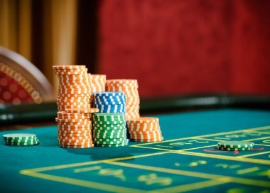 Baccarat table with croupier and player cards visible